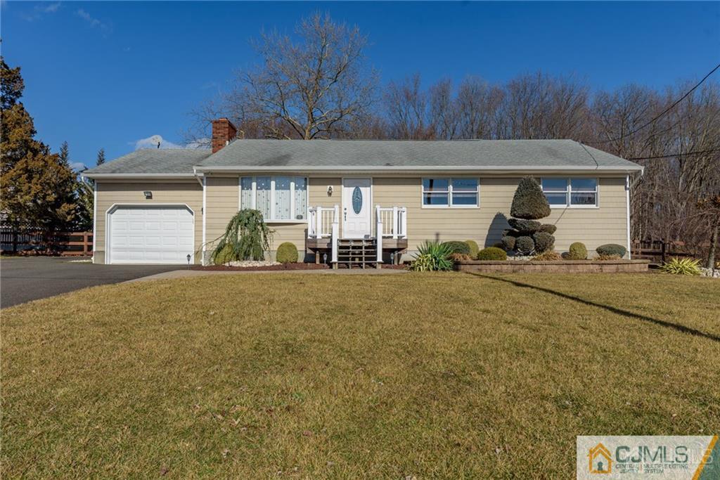 204 Amboy Road Old Bridge, NJ 07747 - Photo 1 of 25 a front view of a house with a yard
