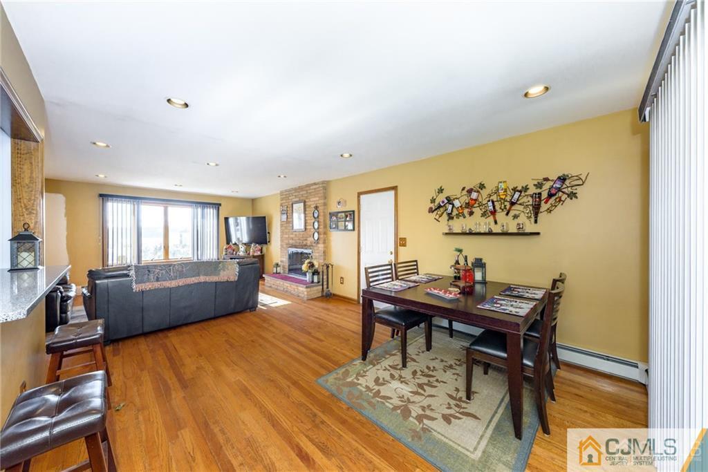 204 Amboy Road Old Bridge, NJ 07747 - Photo 5 of 25 a living room with furniture and a wooden floor