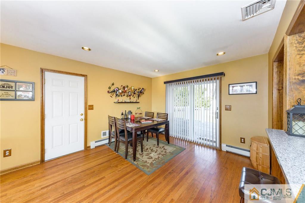 204 Amboy Road Old Bridge, NJ 07747 - Photo 6 of 25 a view of a livingroom with furniture and wooden floor