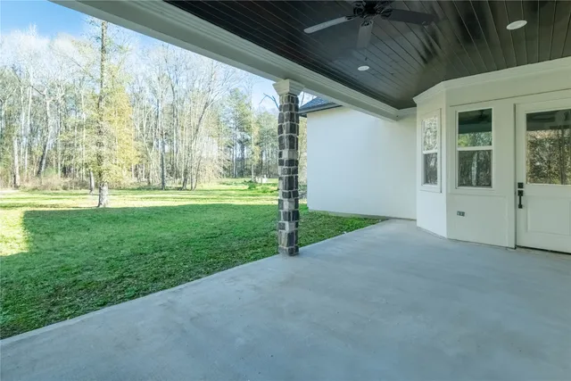 a view of a house with a big yard