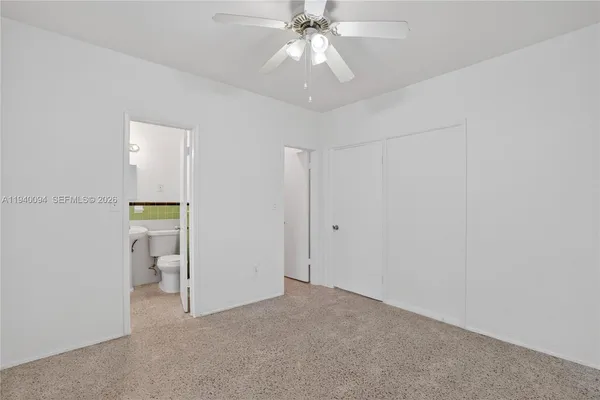 a view of an empty room and fire place