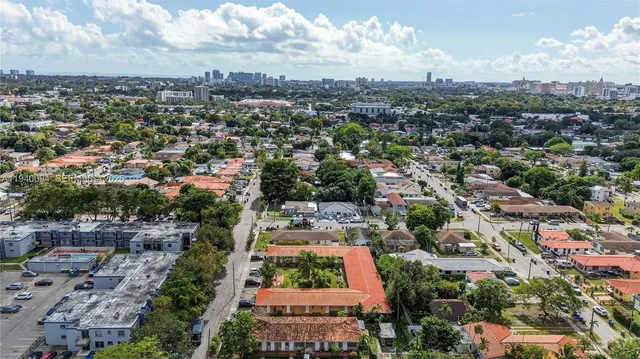 an aerial view of residential building and green space