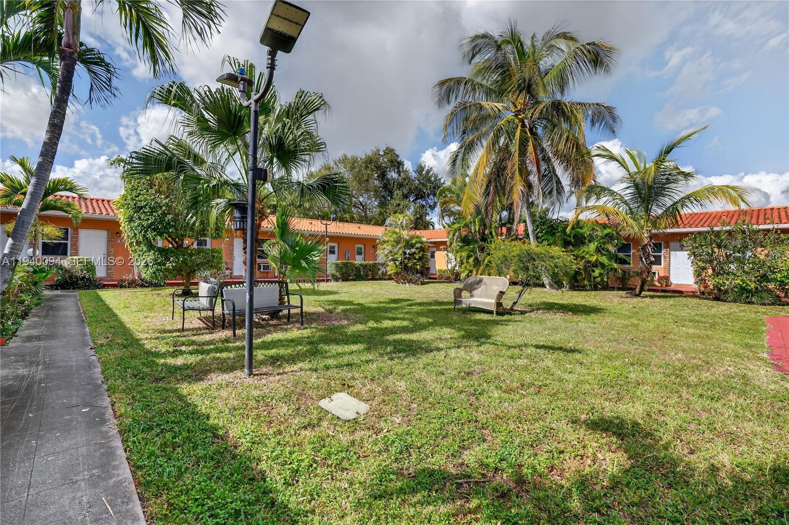 140 Southwest 30th Court, Unit 130 Miami, FL 33135 - Photo 4 of 18 a view of a park with palm trees