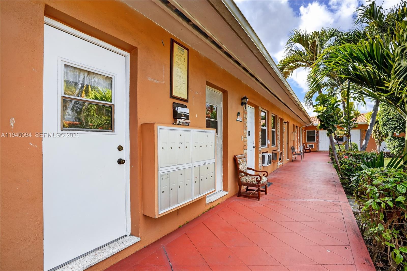 140 Southwest 30th Court, Unit 130 Miami, FL 33135 - Photo 5 of 18 a view of a porch with wooden floor and stairs