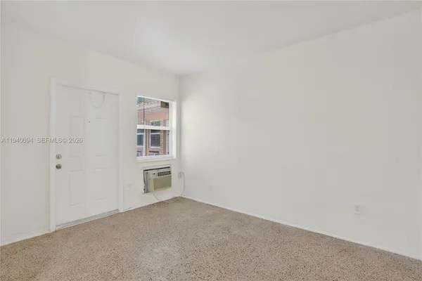 a big room with closet and windows