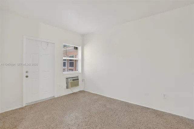 a big room with closet and windows