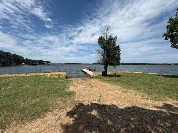 a view of a lake with a yard
