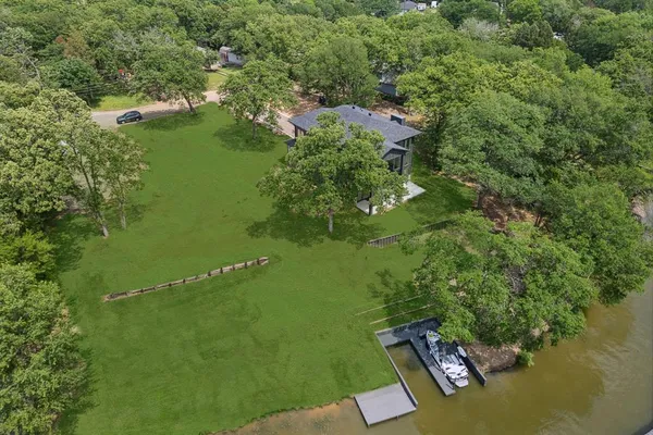 a aerial view of a house with a yard