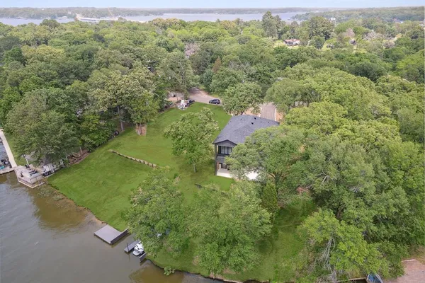 a view of a forest with a houses