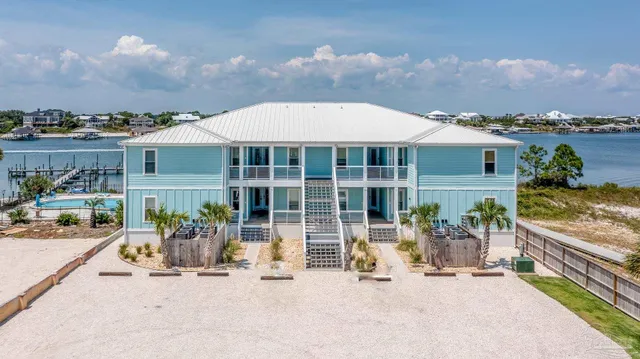 an outdoor view of house with yard space and seating area