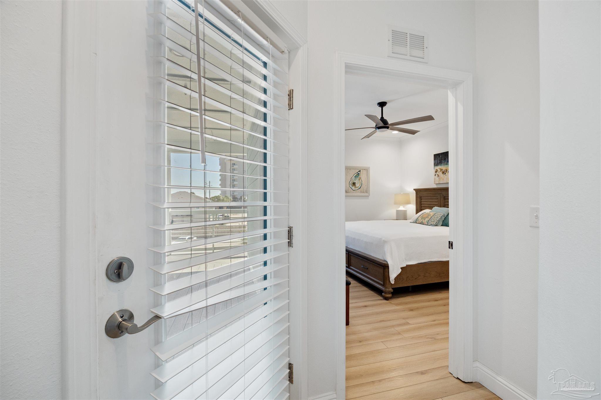 17290 Perdido Key Drive, Unit B2 Pensacola, FL 32507 - Photo 18 of 54 a bedroom with a bed and a window