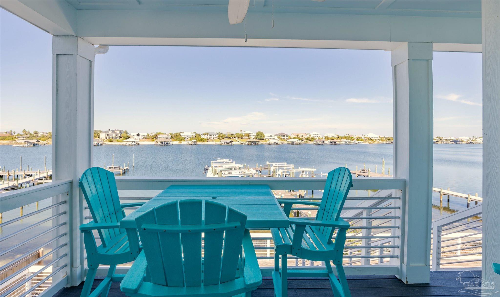 17290 Perdido Key Drive, Unit B2 Pensacola, FL 32507 - Photo 32 of 54 a view of a dining room with furniture window and wooden floor