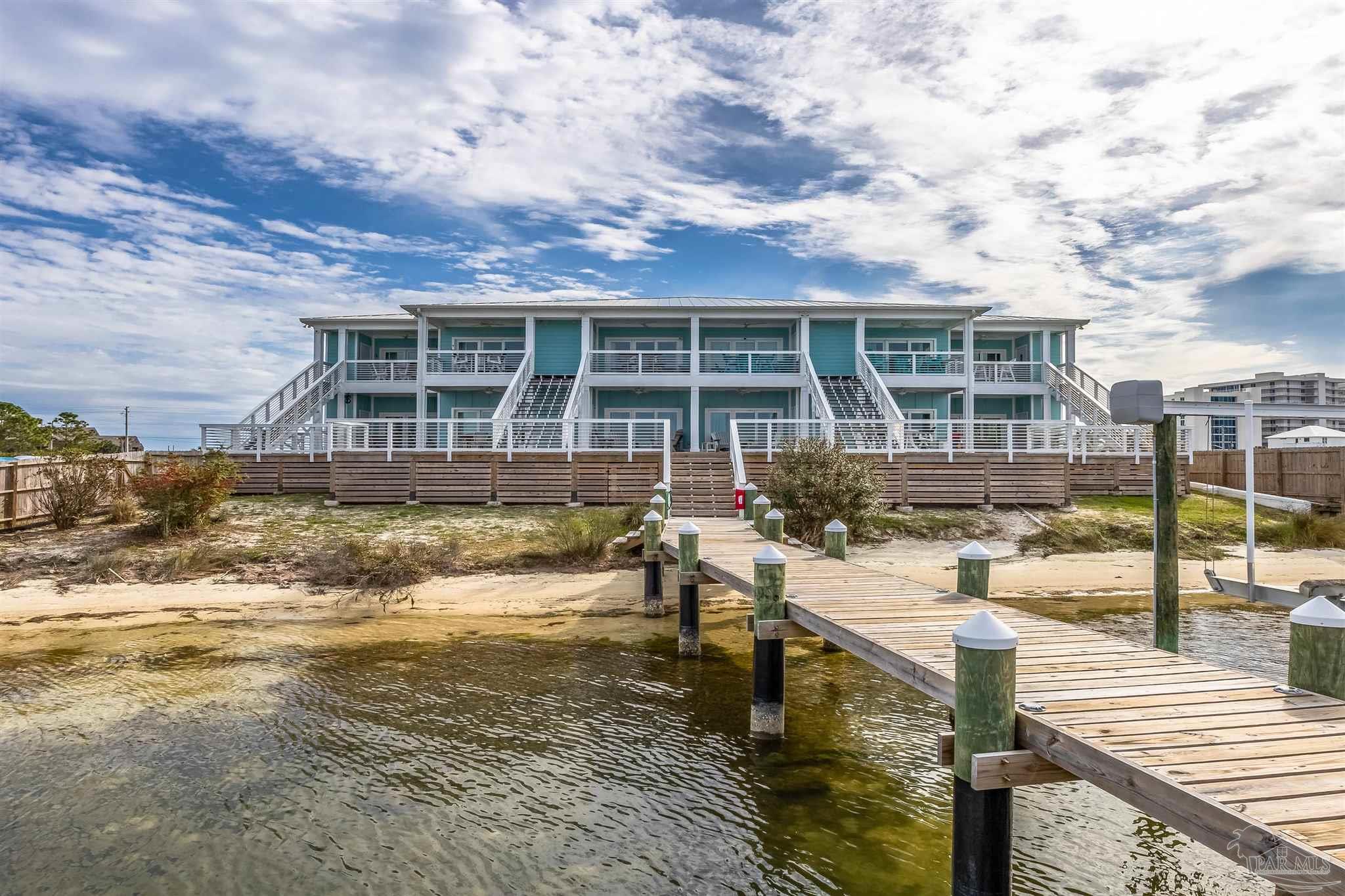 17290 Perdido Key Drive, Unit B2 Pensacola, FL 32507 - Photo 37 of 54 a view of a house with swimming pool and sitting area