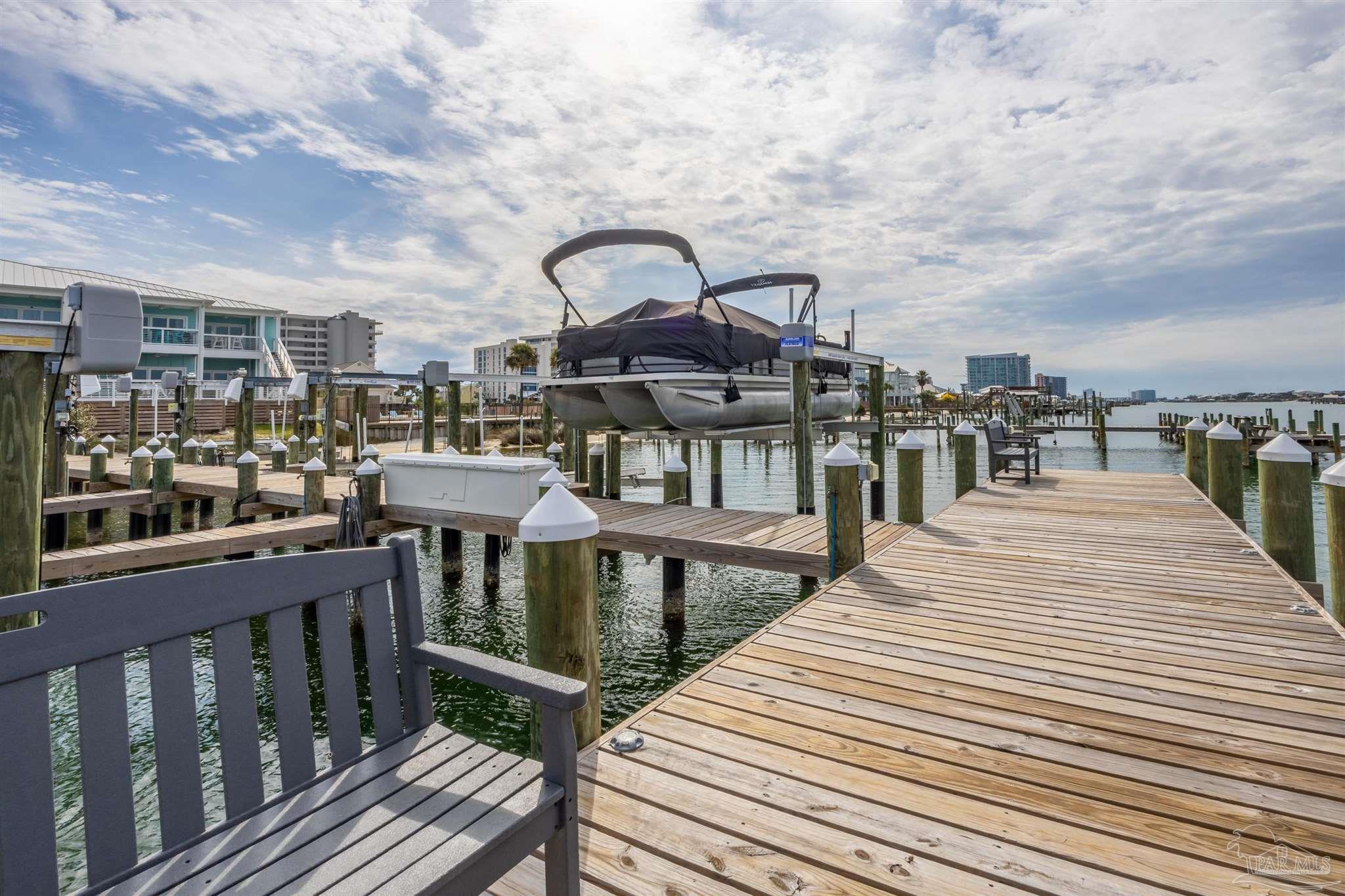 17290 Perdido Key Drive, Unit B2 Pensacola, FL 32507 - Photo 39 of 54 a roof deck with a barbeque and wooden floor
