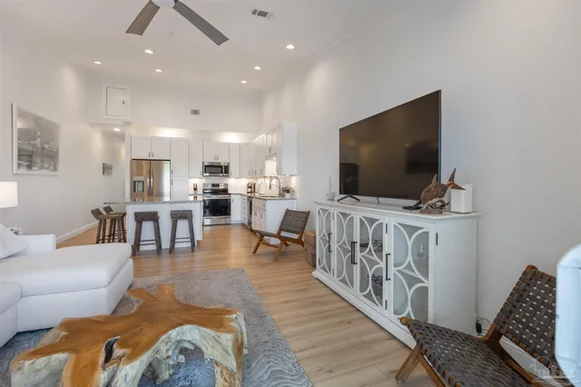 a kitchen with granite countertop white cabinets and sink