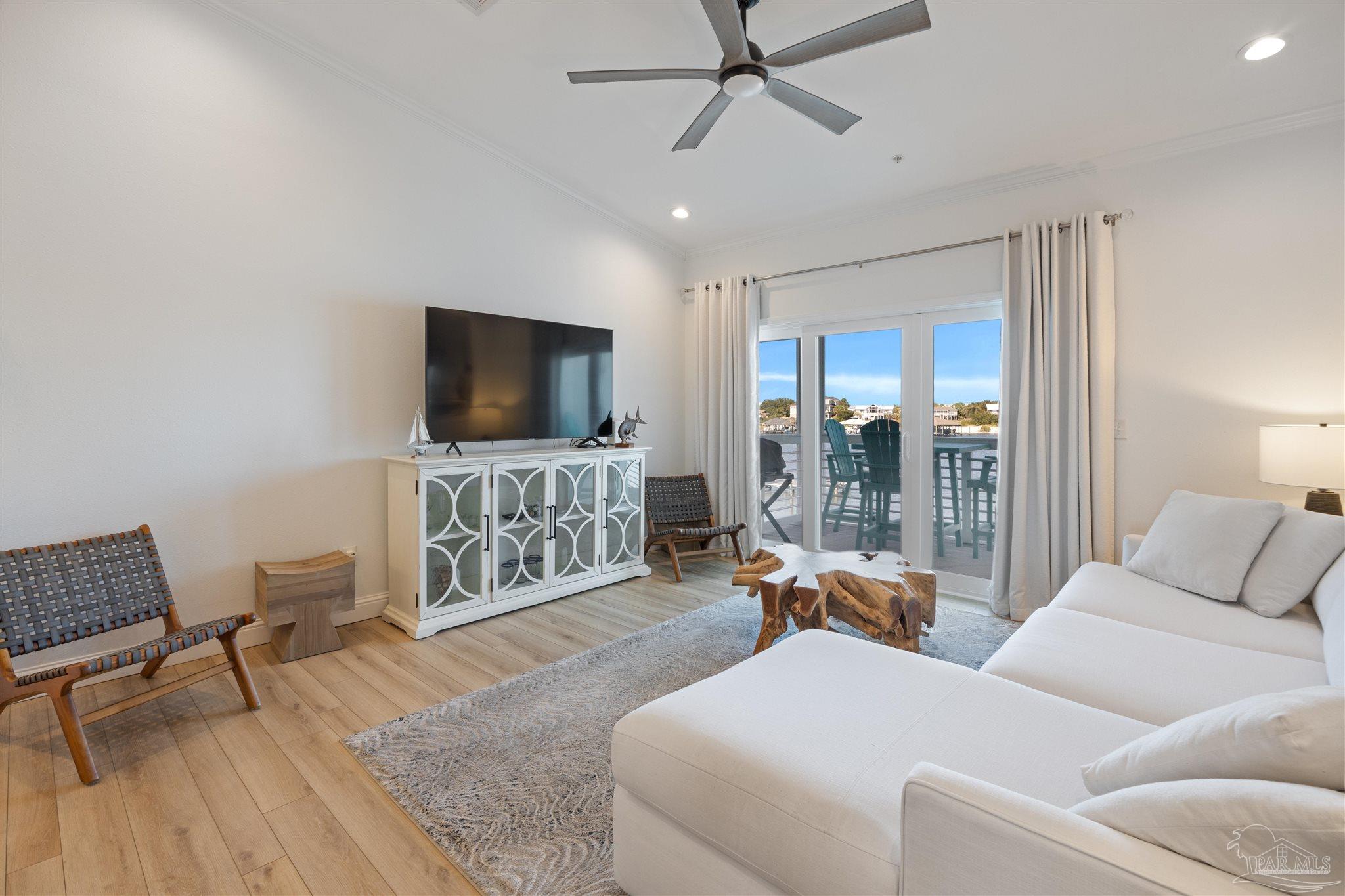 17290 Perdido Key Drive, Unit B2 Pensacola, FL 32507 - Photo 10 of 54 a living room with furniture and a flat screen tv