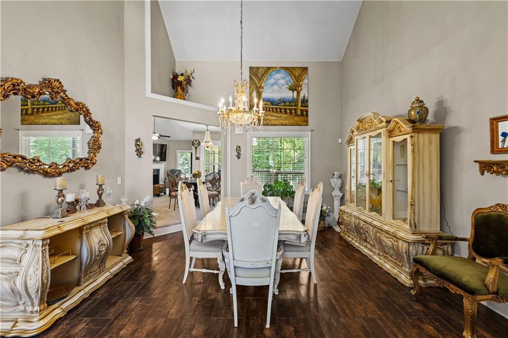 915 Magnolia Way Hampton, GA 30228 - Photo 17 of 68 a view of a dining room with furniture a chandelier and wooden floor