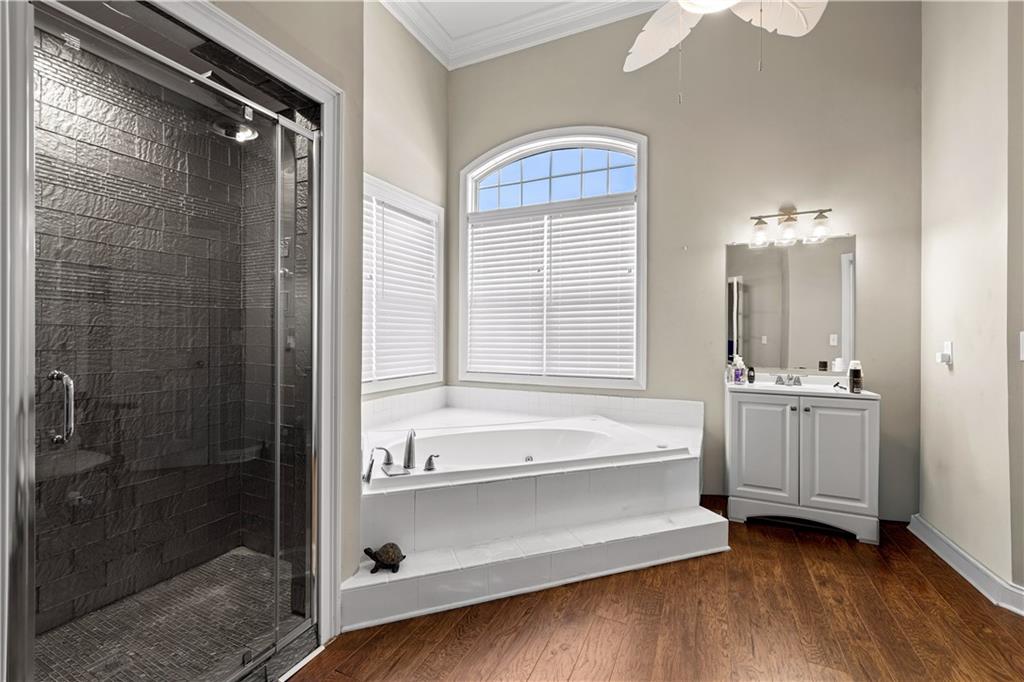 915 Magnolia Way Hampton, GA 30228 - Photo 30 of 68 a bathroom with a tub shower and sink