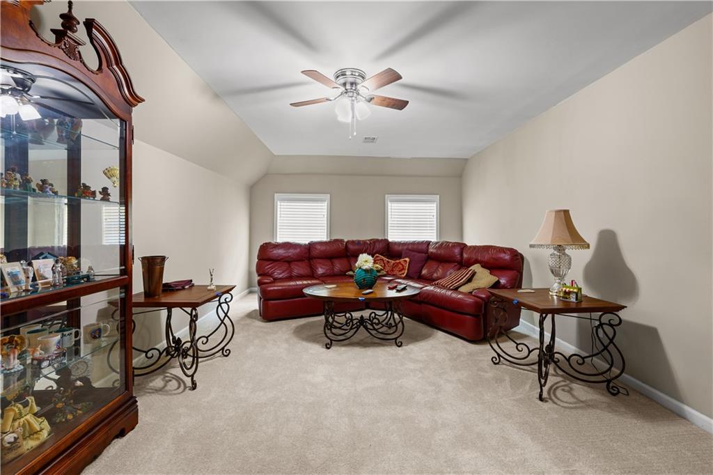 915 Magnolia Way Hampton, GA 30228 - Photo 46 of 68 a living room with furniture and white walls