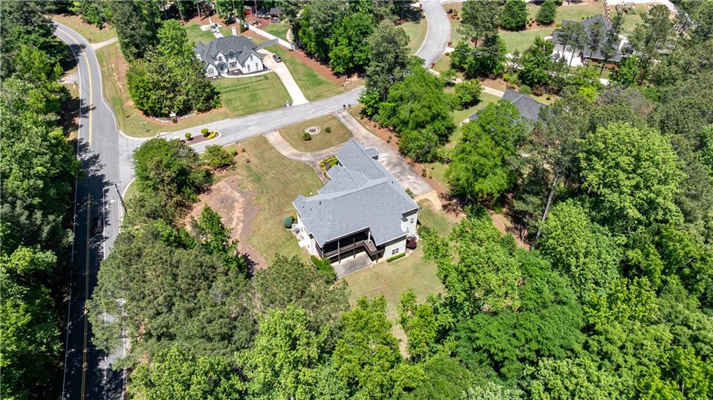 915 Magnolia Way Hampton, GA 30228 - Photo 64 of 68 an aerial view of a house with a yard and outdoor space