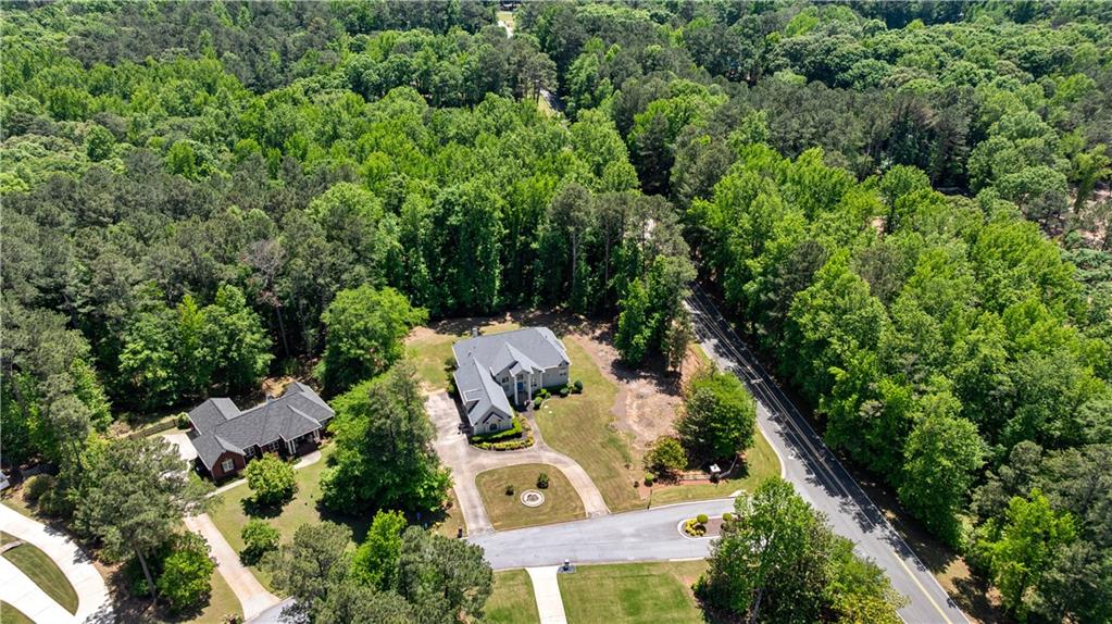 915 Magnolia Way Hampton, GA 30228 - Photo 65 of 68 an aerial view of residential house with outdoor space and trees all around