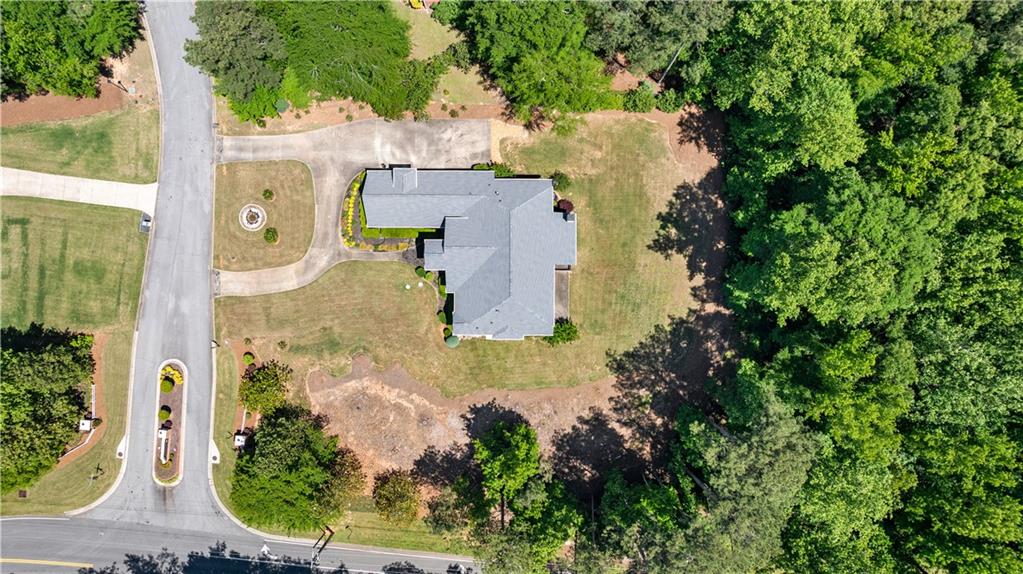 915 Magnolia Way Hampton, GA 30228 - Photo 68 of 68 an aerial view of residential house with outdoor space and swimming pool