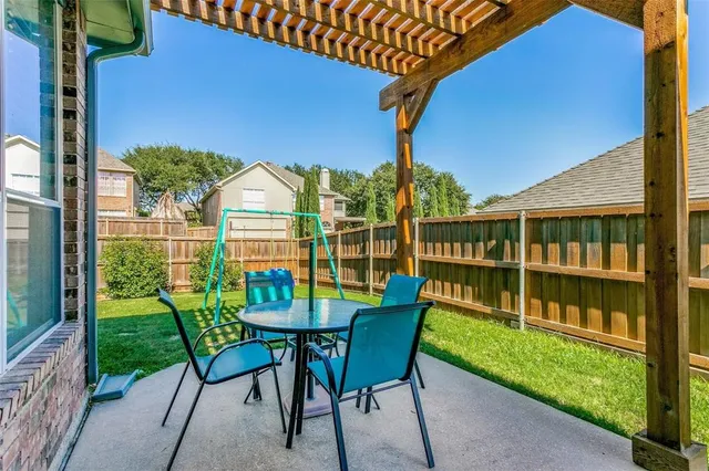 a view of a house with backyard and deck