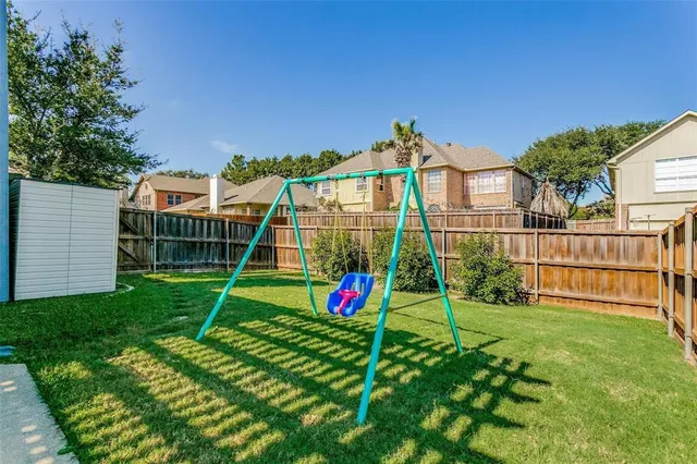 a view of a house with a backyard and a porch