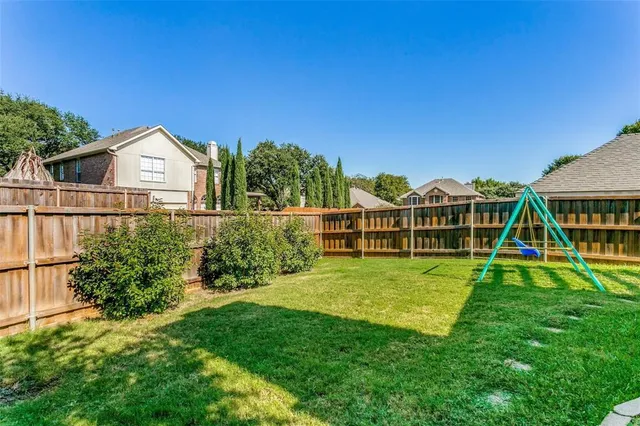 a view of a park with large trees