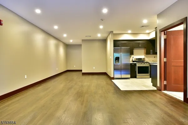 a view of a kitchen with a sink and an oven