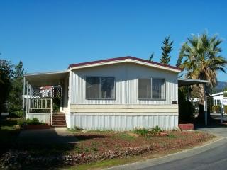 216 Olympic Way, Unit 216 San Rafael, CA 94903 - Photo 1 of 1 a front view of a house with a yard
