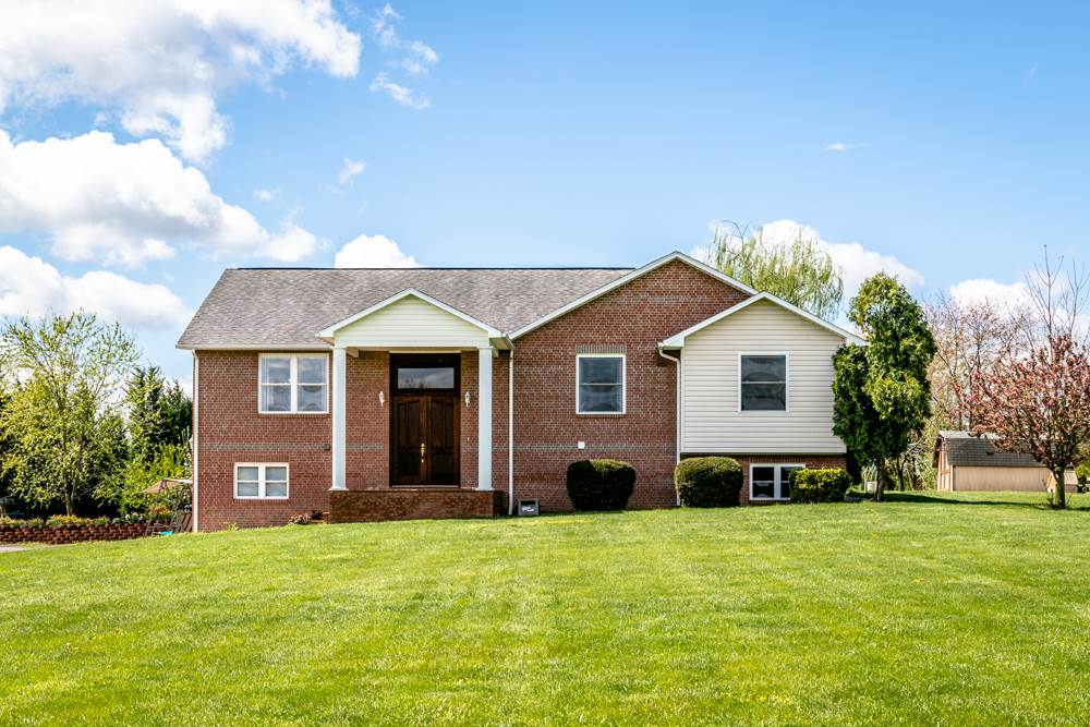 152 Millers Road Bridgewater, VA 22812 - Photo 1 of 50 a front view of a house with a garden and yard