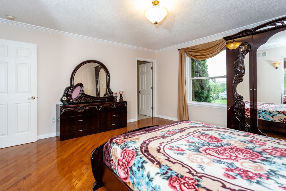 152 Millers Road Bridgewater, VA 22812 - Photo 13 of 50 a bedroom with a bed and a dresser