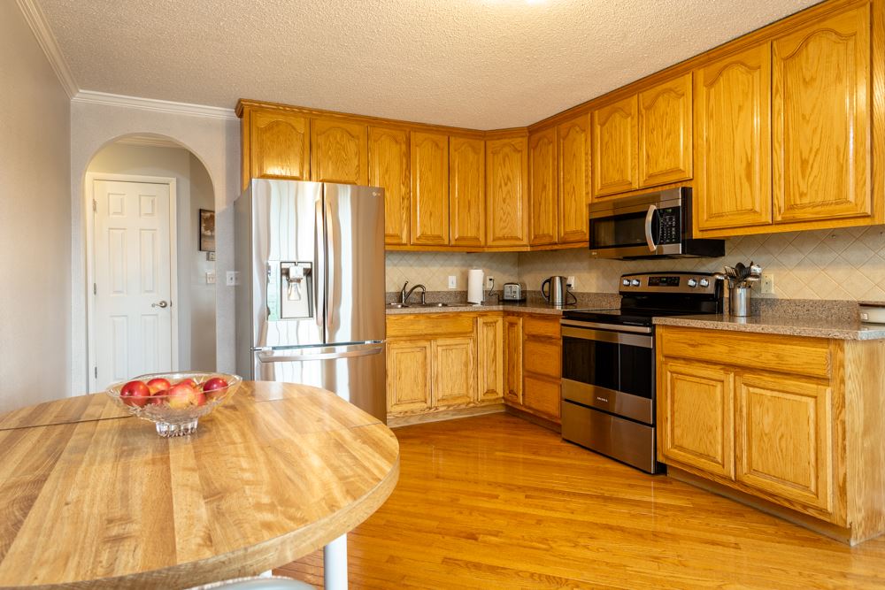 152 Millers Road Bridgewater, VA 22812 - Photo 2 of 50 a kitchen with a stove a sink and a refrigerator
