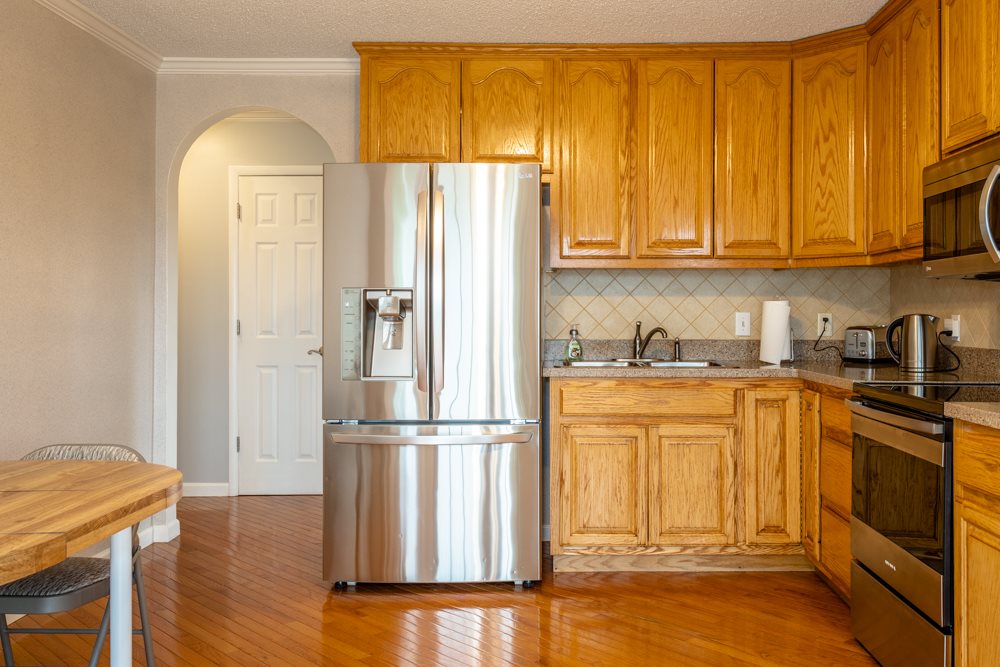152 Millers Road Bridgewater, VA 22812 - Photo 6 of 50 a kitchen with stainless steel appliances granite countertop a refrigerator a stove and a sink with granite countertops
