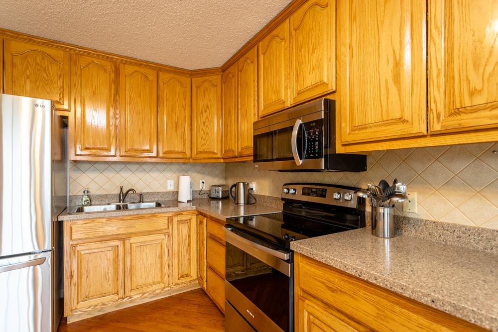 152 Millers Road Bridgewater, VA 22812 - Photo 7 of 50 a kitchen with a sink stove and microwave