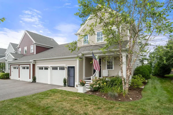 front view of a house with a yard