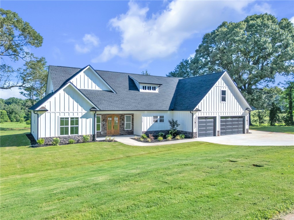 1727 Harris Bridge Road Anderson, SC 29621 - Photo 2 of 35 A modern farmhouse design with board and batten siding provides exceptional curb appeal.