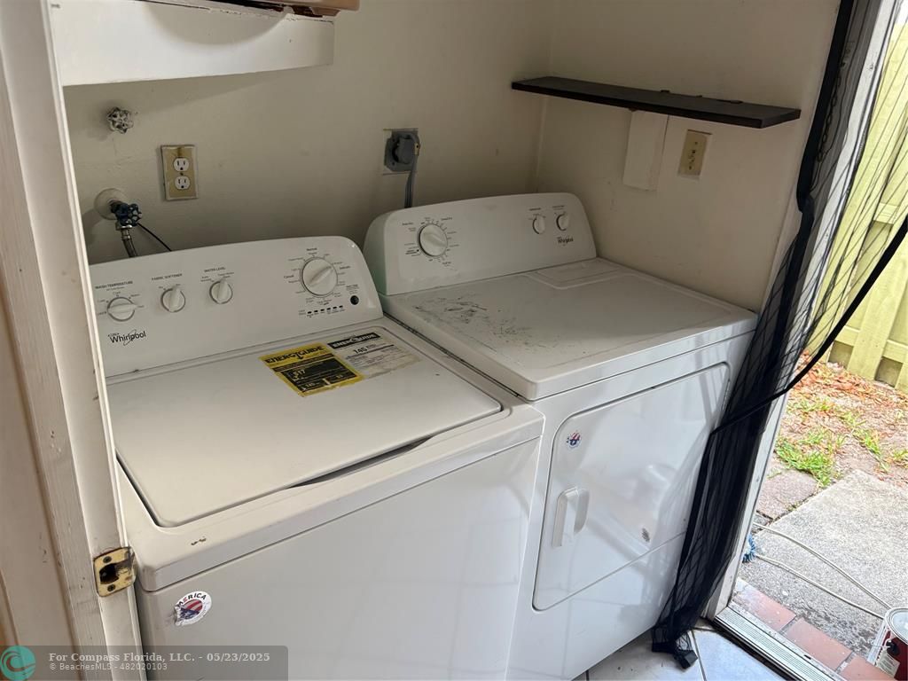 7659 Northwest 74th Avenue Tamarac, FL 33321 - Photo 11 of 11 a utility room with dryer and washer