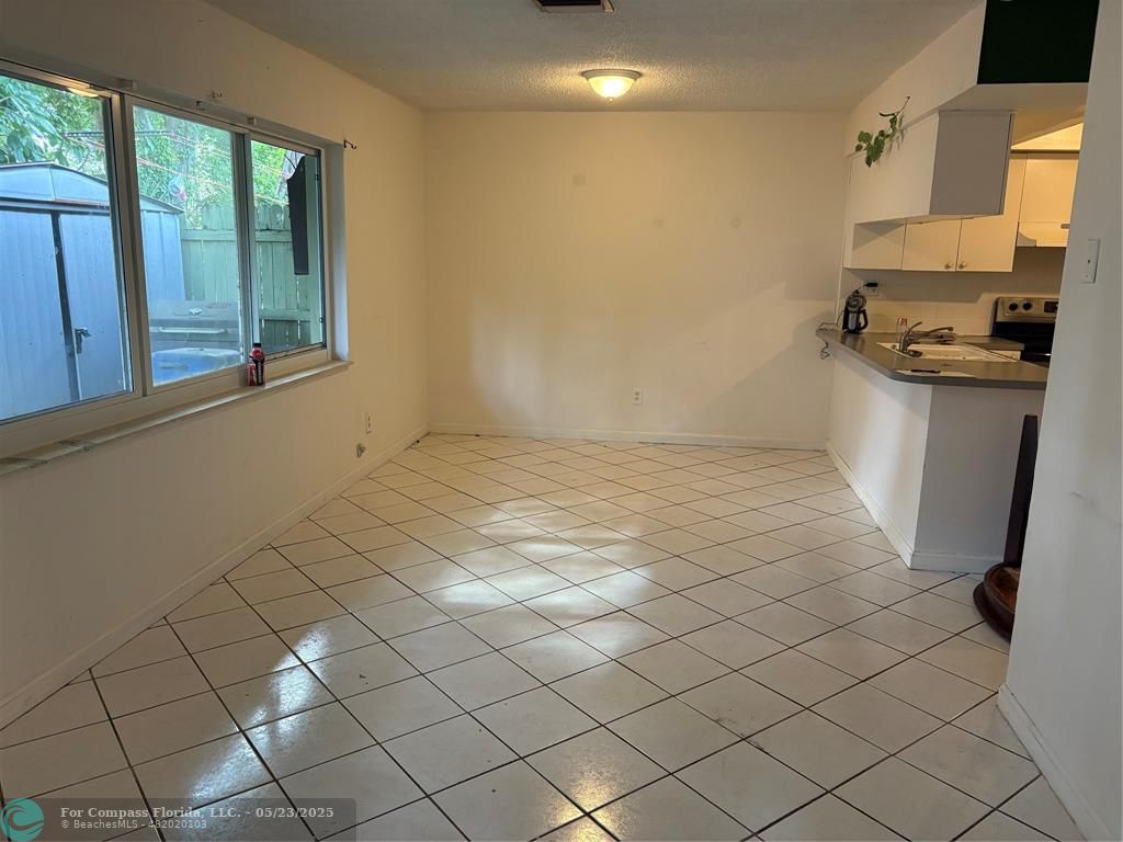 7659 Northwest 74th Avenue Tamarac, FL 33321 - Photo 7 of 11 a view of a refrigerator and window