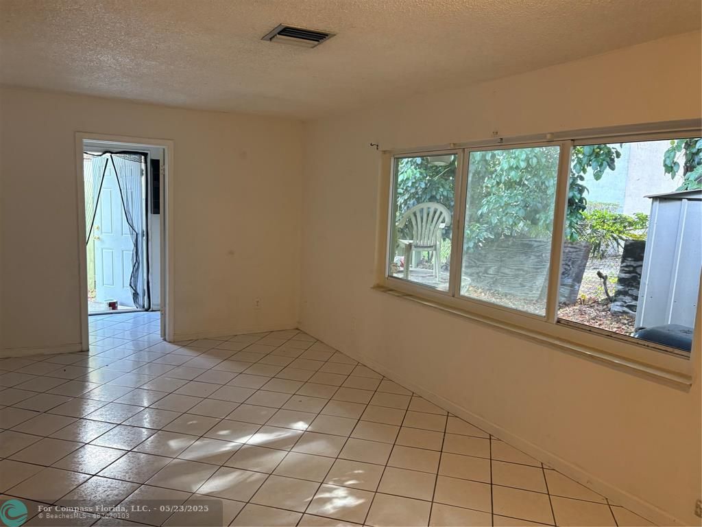 7659 Northwest 74th Avenue Tamarac, FL 33321 - Photo 8 of 11 a view of an empty room with a window