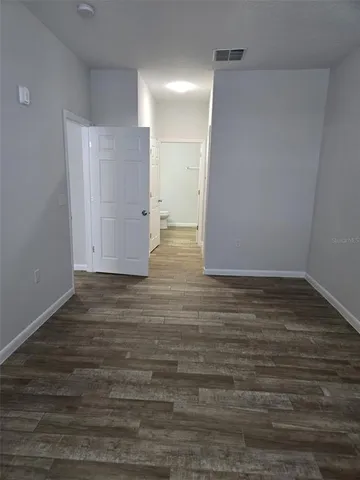 a view of room with hardwood floor