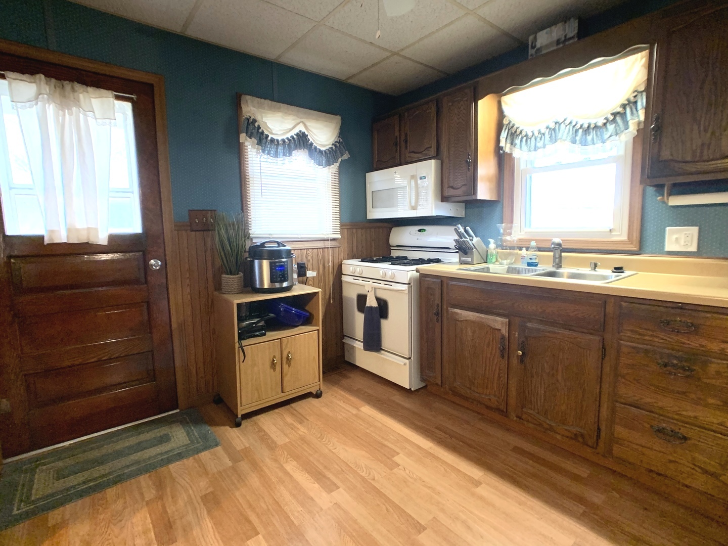 608 West Cleveland Street Spring Valley, IL 61362 - Photo 11 of 35 a kitchen with a stove sink and cabinets