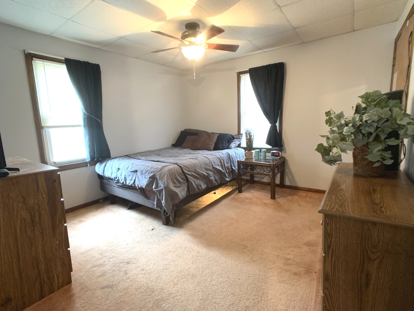 608 West Cleveland Street Spring Valley, IL 61362 - Photo 18 of 35 a bed sitting in a bedroom next to a window