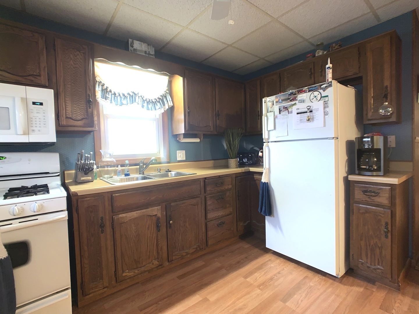608 West Cleveland Street Spring Valley, IL 61362 - Photo 10 of 35 a kitchen with refrigerator cabinets and a table