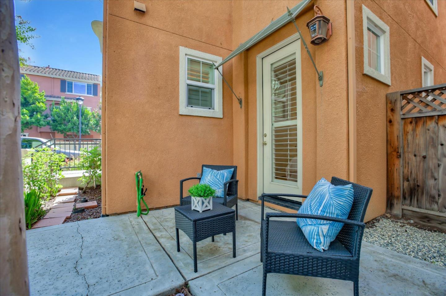 4203 Tobin Circle Santa Clara, CA 95054 - Photo 2 of 33 a view of patio with a table and chairs and potted plants