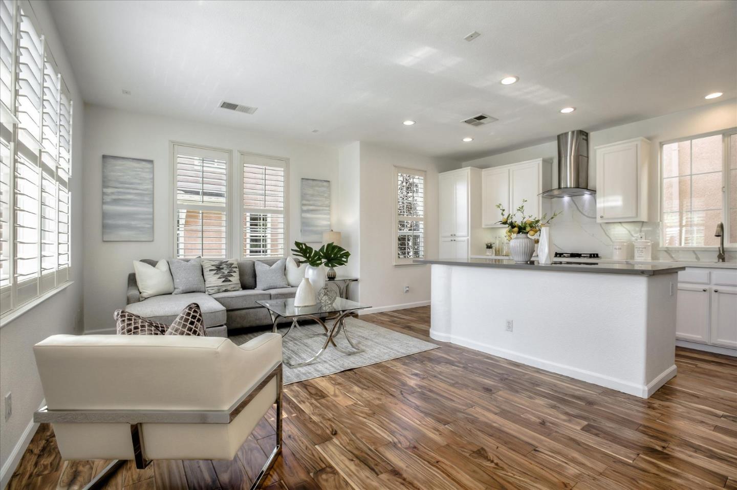 4203 Tobin Circle Santa Clara, CA 95054 - Photo 11 of 33 a living room with kitchen island furniture and a large window