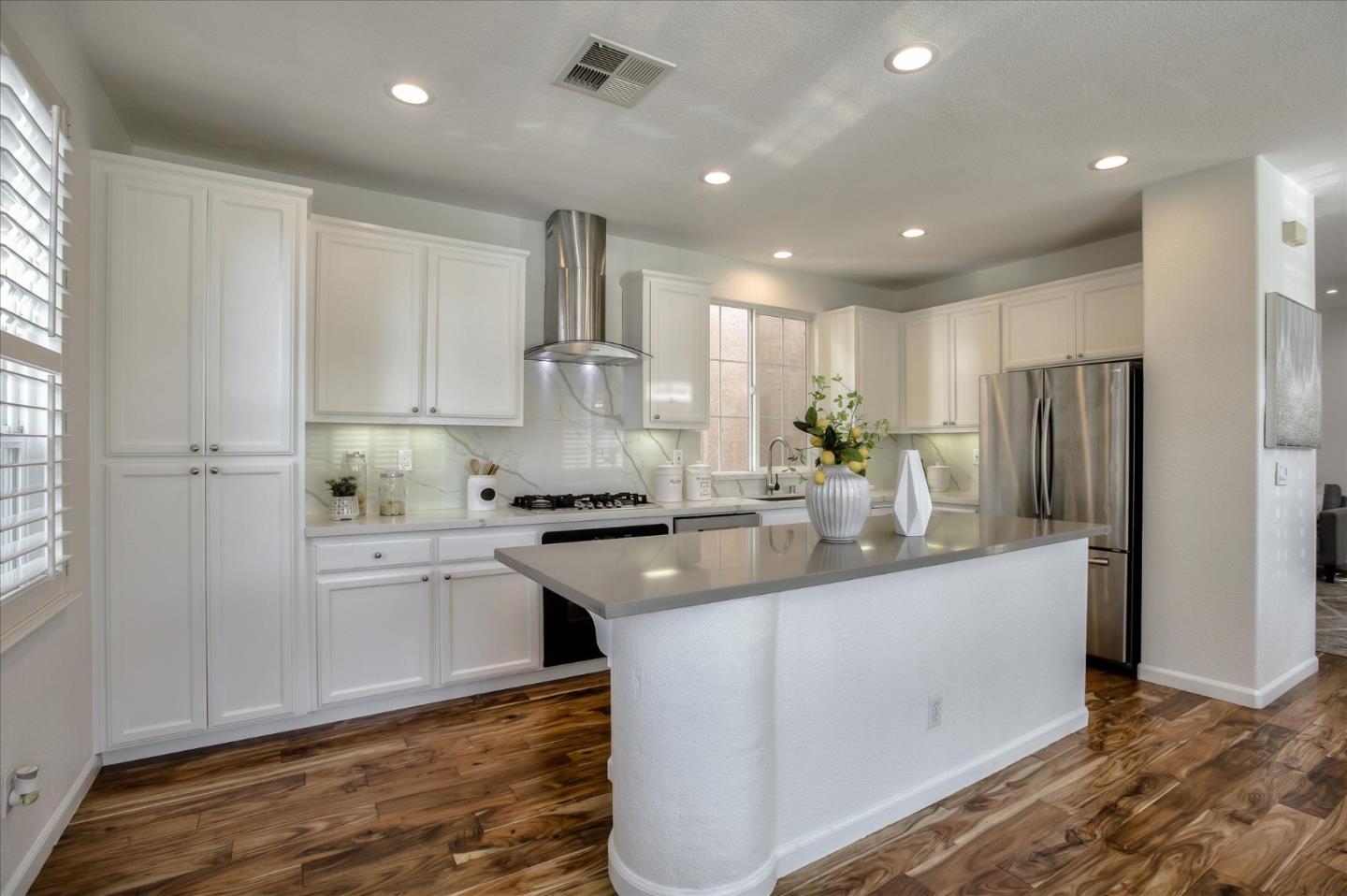4203 Tobin Circle Santa Clara, CA 95054 - Photo 12 of 33 a kitchen with stainless steel appliances granite countertop a sink a stove a refrigerator and cabinets