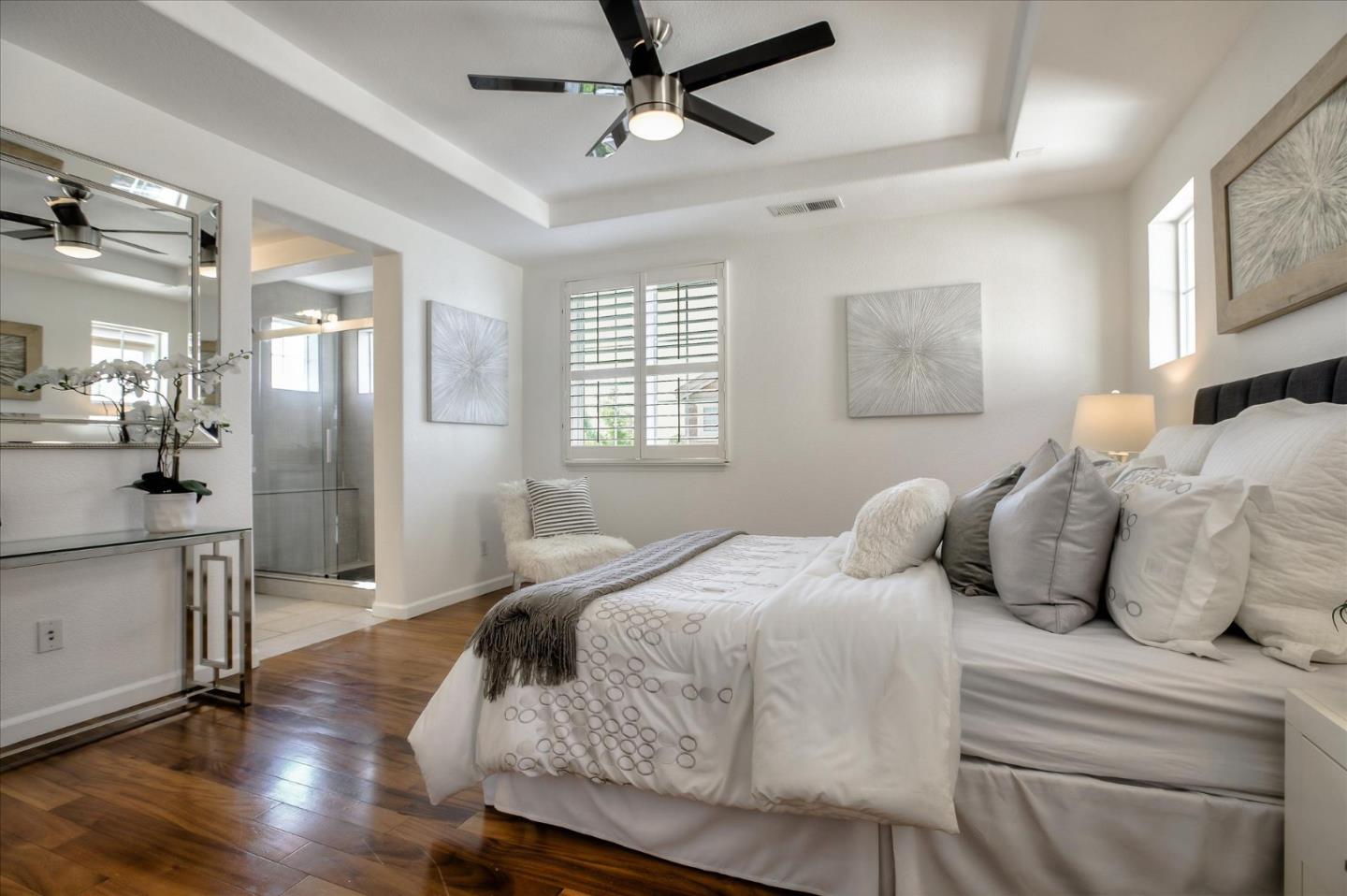 4203 Tobin Circle Santa Clara, CA 95054 - Photo 20 of 33 a bedroom with a large bed and a wooden floor