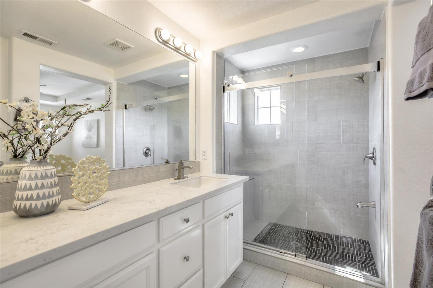 4203 Tobin Circle Santa Clara, CA 95054 - Photo 21 of 33 a bathroom with a granite countertop sink mirror and shower